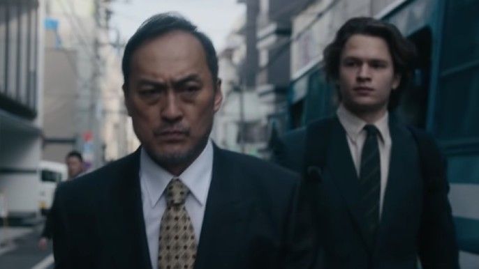 Tokyo Vice Ansel Elgort as Jake Adelstein and Ken Watanabe as Hiroto Katagiri exiting bus