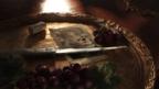 a gold plate with a knife a playing card and grapes mafia 4