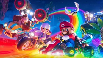 Mario and his friends race across Rainbow Road in the Mario Movie