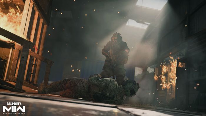 Image showing two Modern Warfare 2 players in dark room