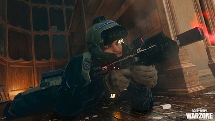 Screenshot of Warzone player laying prone and aiming down sights of an SMG