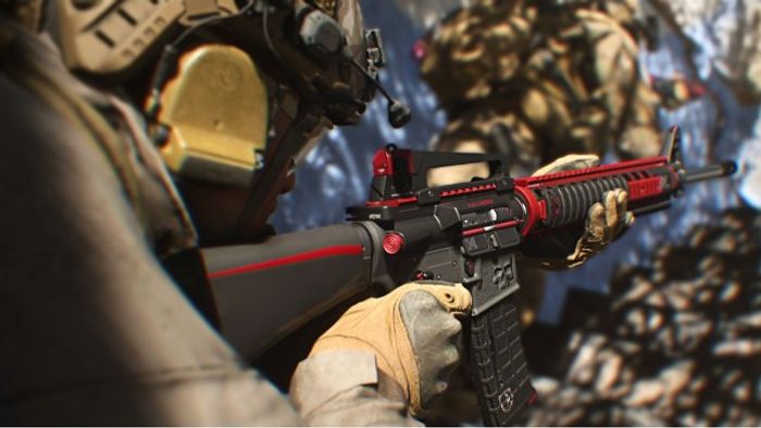 Modern Warfare 2 player holding M16 with red and black camo