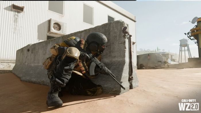 Warzone 2 player taking cover by concrete block