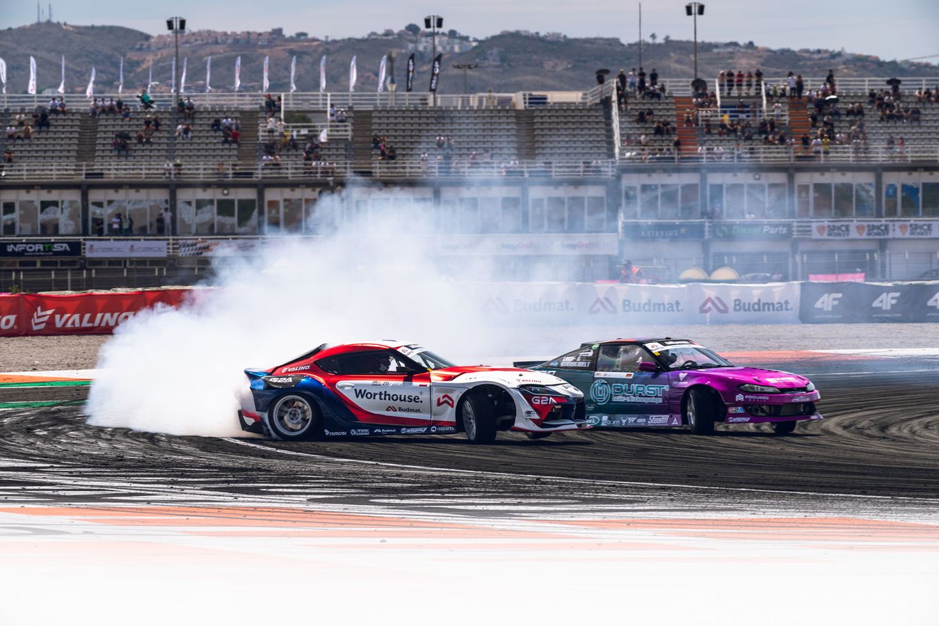 Two cars tandem drifting in the Drift Masters championship