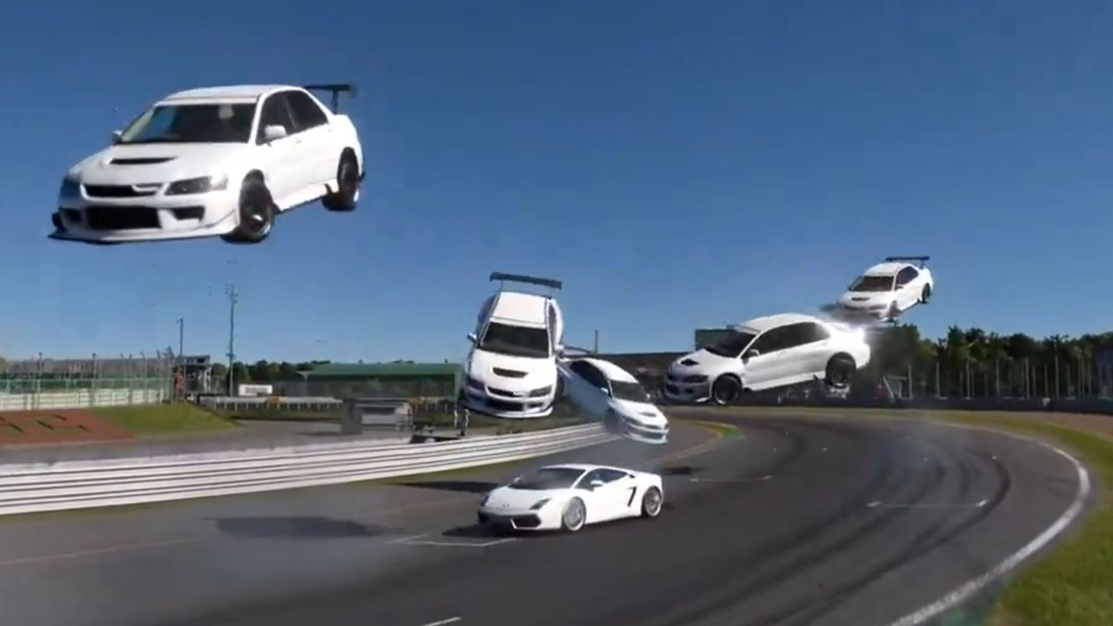 a group of white cars are flying through the air over a race track .