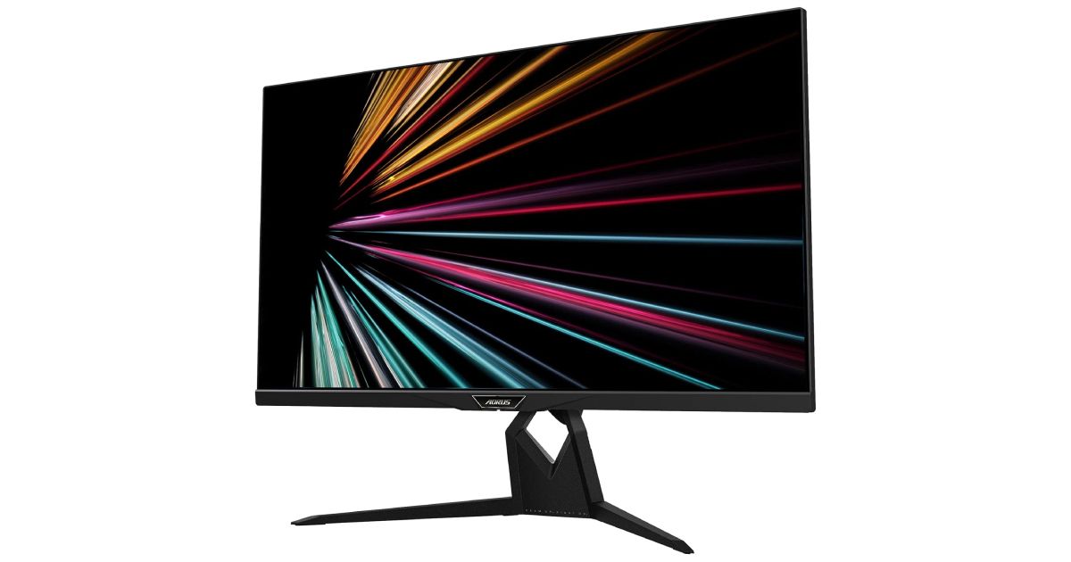 Gigabyte AORUS FI32U product image of a black monitor featuring orange, pink, and light blue lines on a black background on the display.