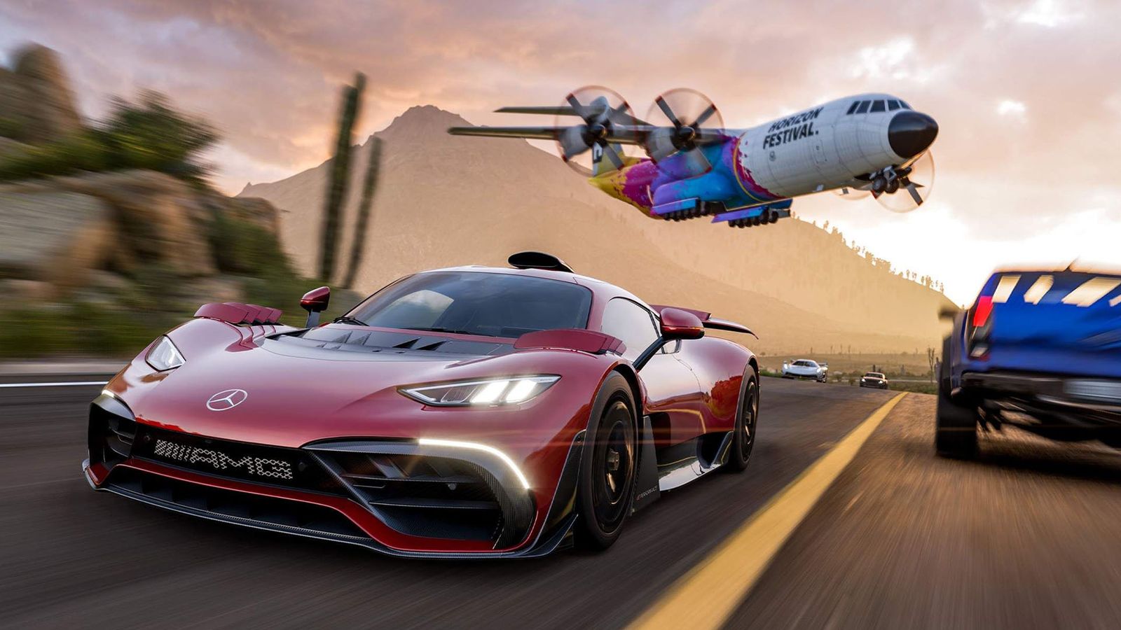 a red sports car is driving down a road with a plane flying overhead .