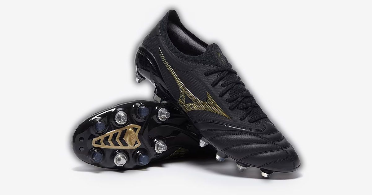 A pair of black Mizuno football boots featuring gold branding along the side.