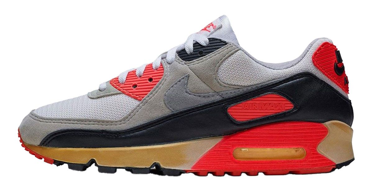 Nike Air Max 90 product image of a light grey, black, and red sneaker.