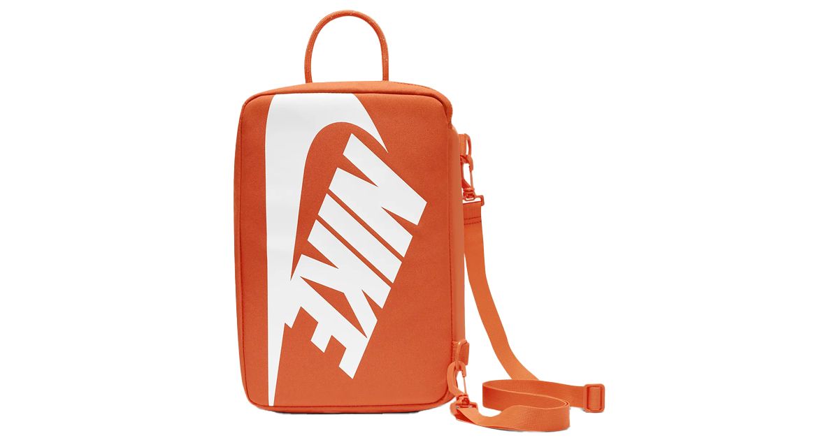 Nike Shoe Box Bag product image of a rectangular orange bag with white Nike branding on the front.