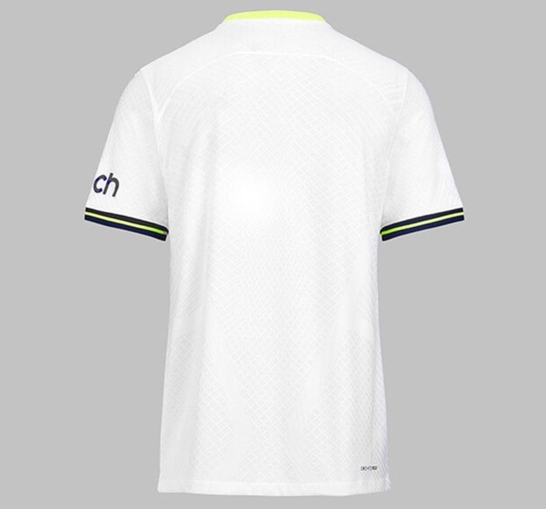 Tottenham Hotspur home kit 2022/23 product image of the neon yellow and navy blue collar on a white kit.