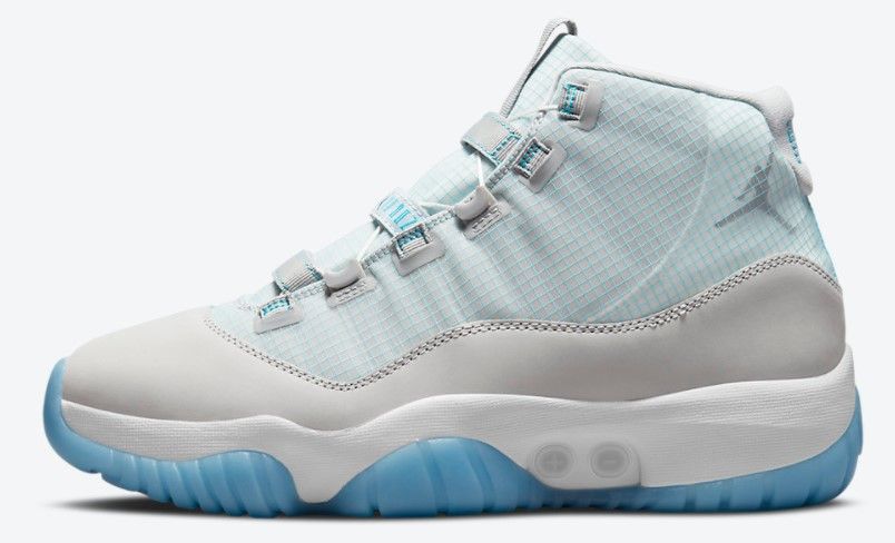 Air Jordan 11 Adapt product image of a white and light blue sneaker.