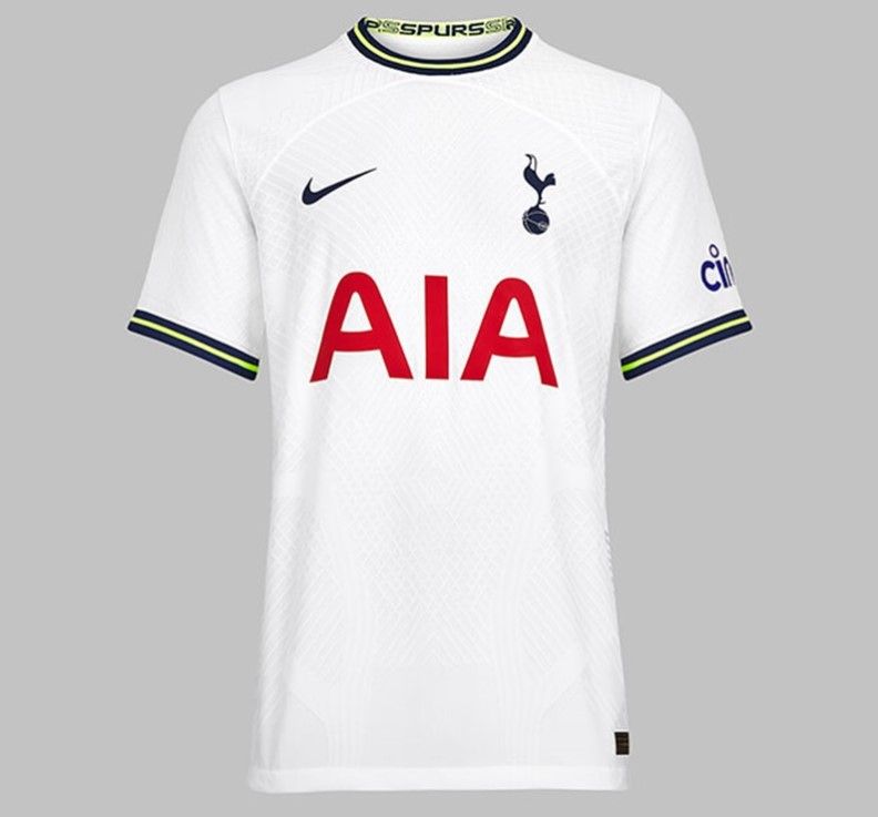 Tottenham Hotspur home kit 2022/23 product image of the neon yellow and navy blue collar on a white kit.