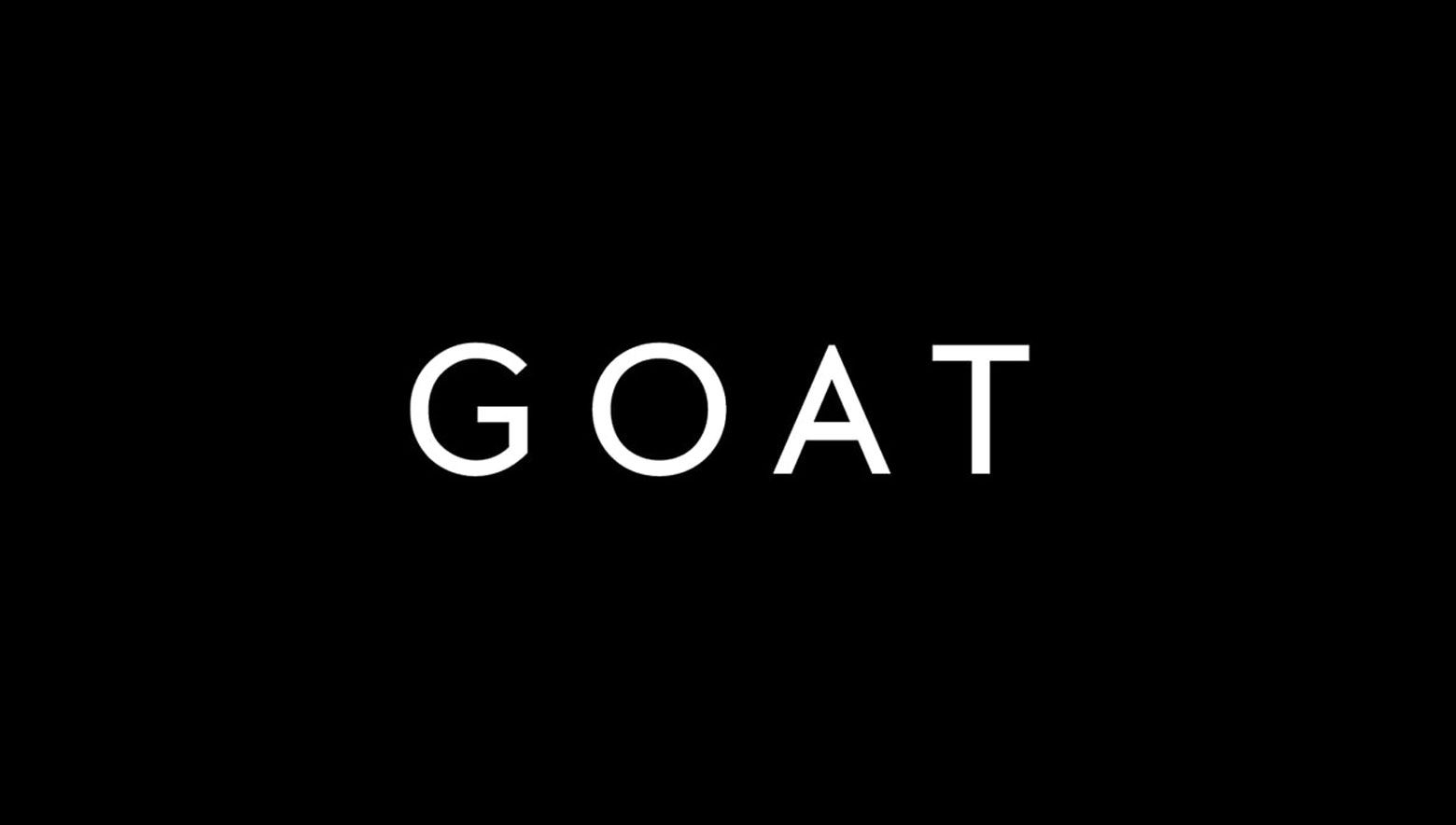 The GOAT logo in white.