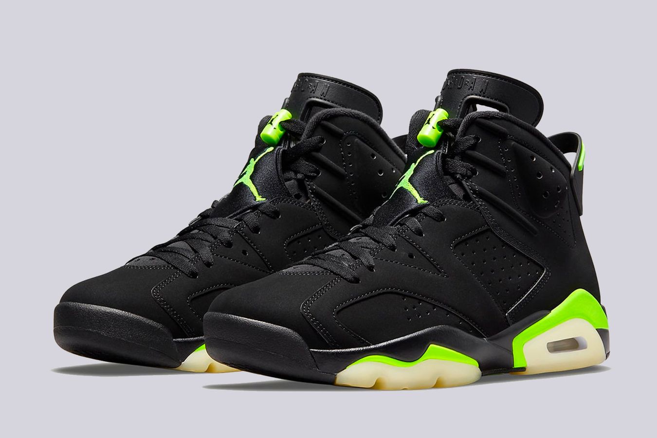 Best Air Jordan 6 colorways "Electric Green" product image of a pair of black sneakers with light green details and gum soles.