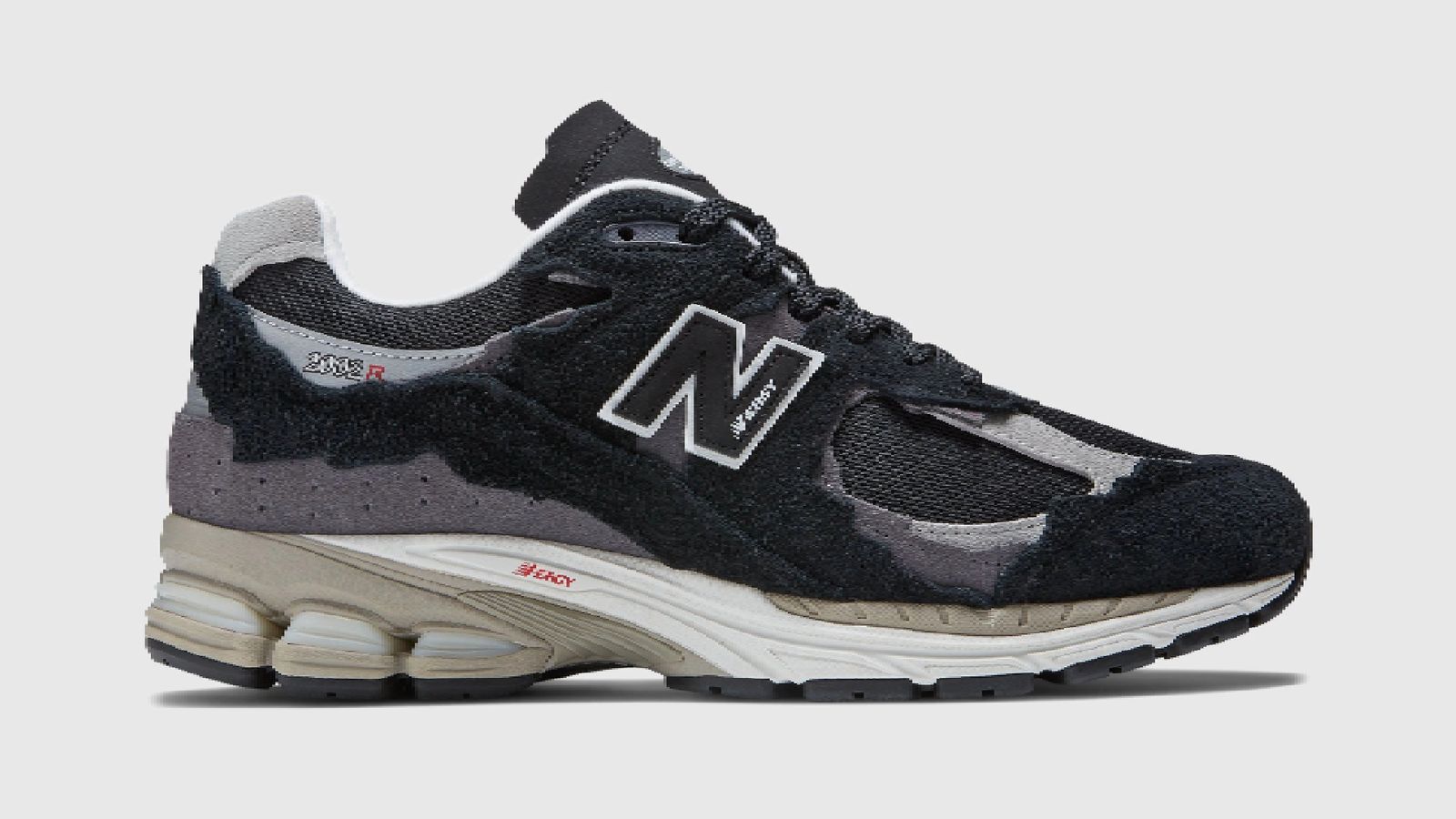 New Balance 2002R Protection Pack "Black Grey" product image of a black and grey low-top sneaker featuring distressed cutout sections.