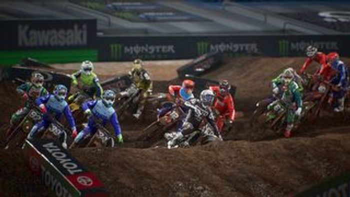 A pack of riders approaches a jump on Monster Energy Supercross 3