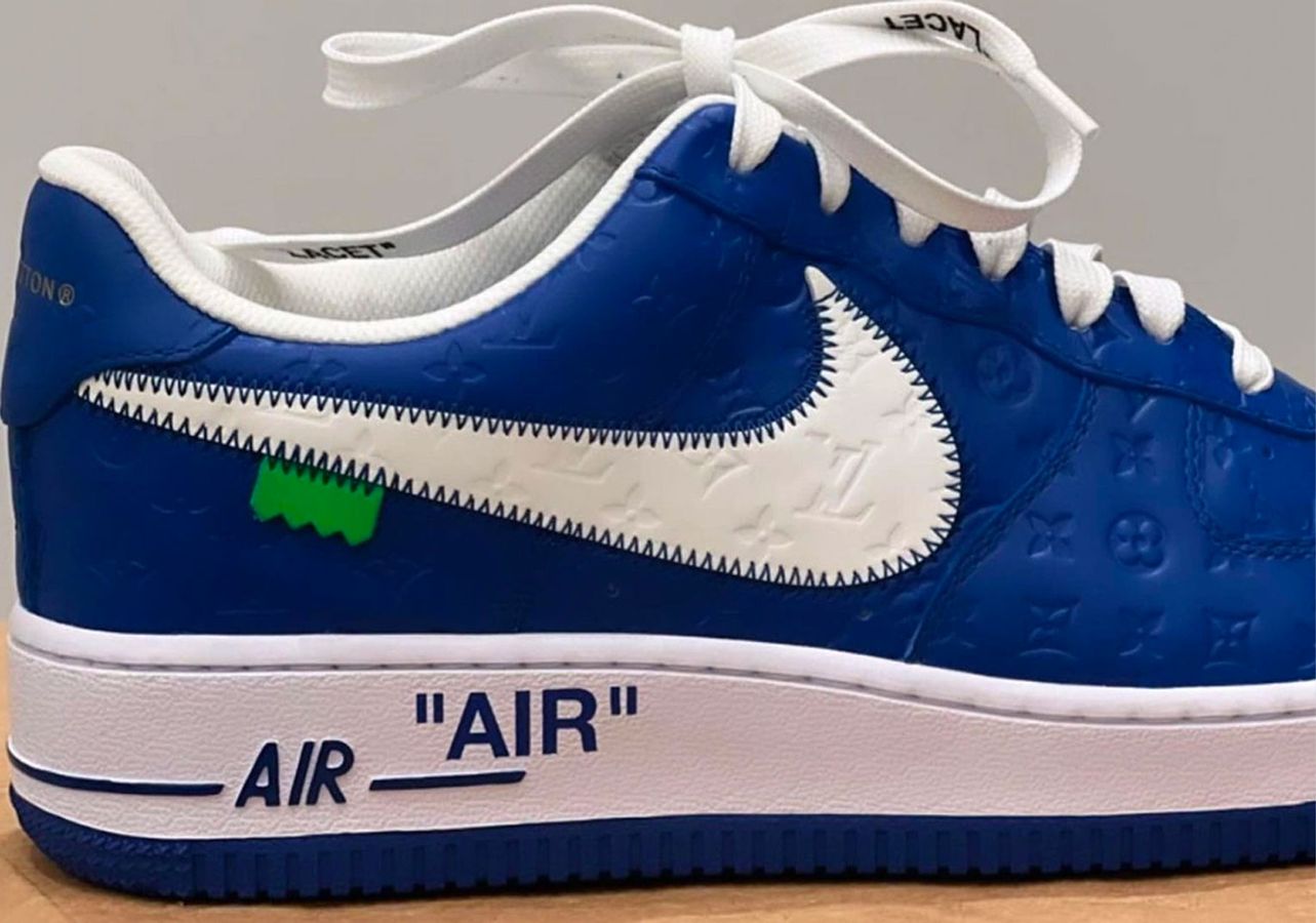 Louis Vuitton x Off-White x Nike Air Force 1 product image of a blue and white LV debossed sneaker.