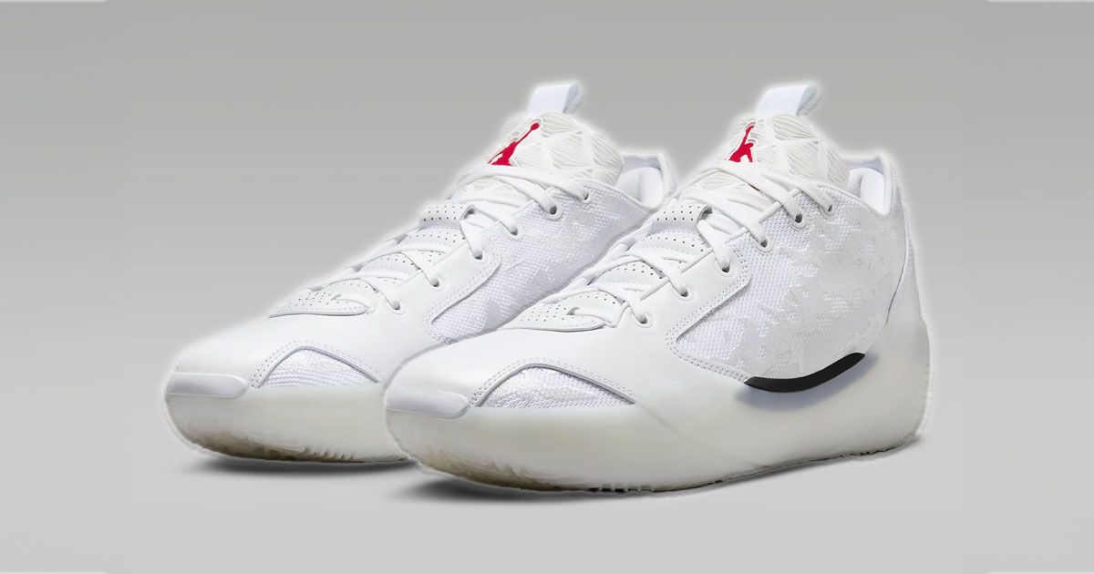 A white pair of Air Jordan XXXIX's with featuring a red Jordan logo on the tongues.