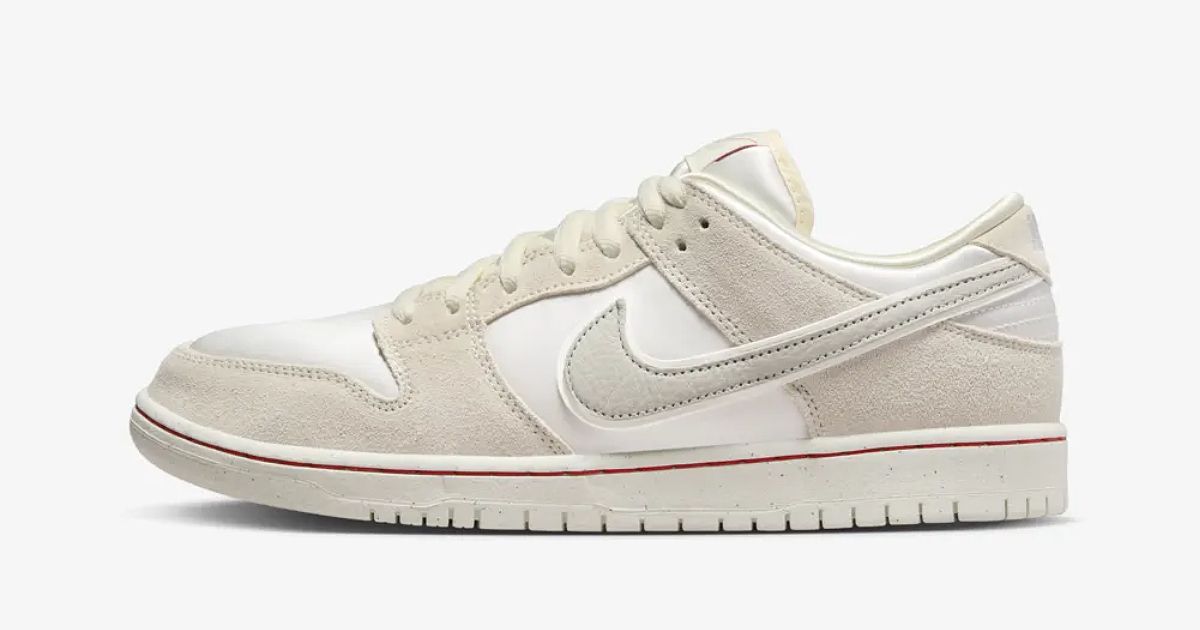 Nike SB Dunk Low "Coconut Milk" product image of a coconut milk-coloured low-top featuring suede bone-coloured overlays and a red line around the midsole.