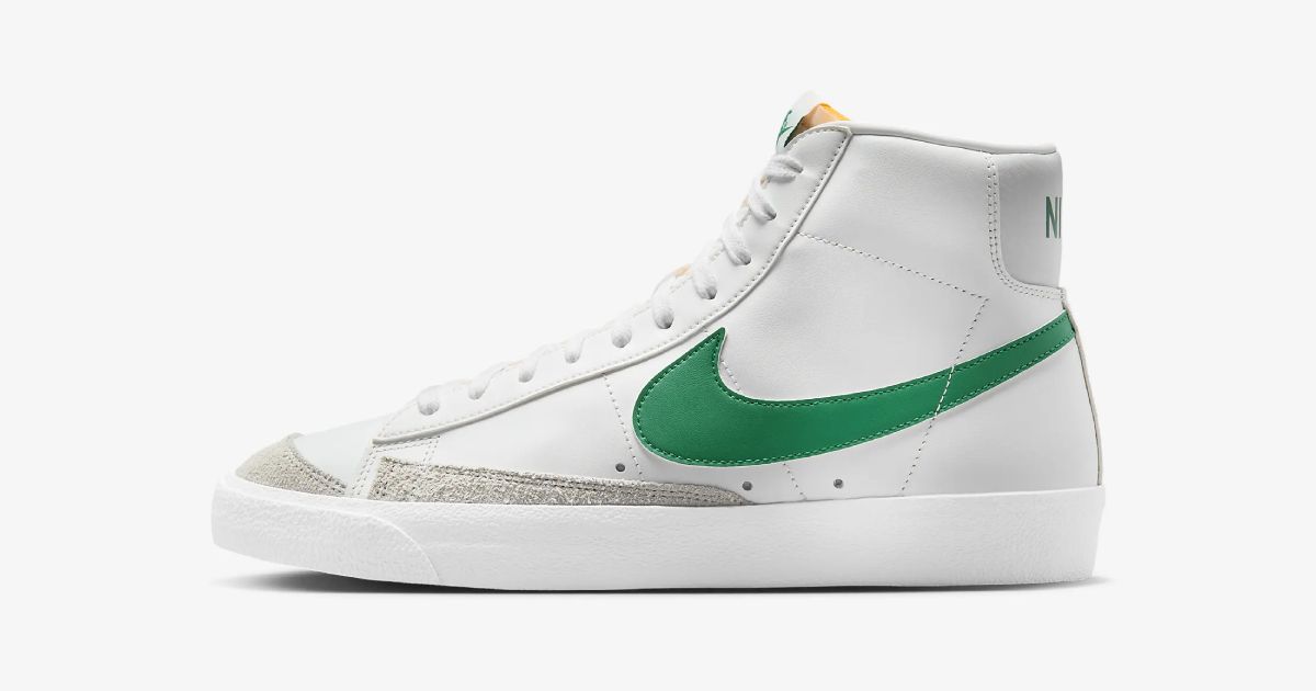 A white Blazer Mid with a green Swoosh down the sidewall.