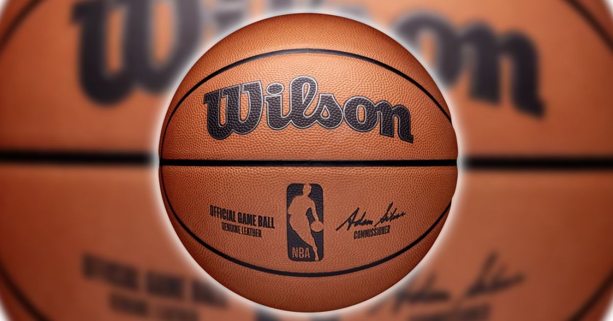 Wilson NBA Official Game Basketball product image of a light brown official NBA ball with a white outer glow.