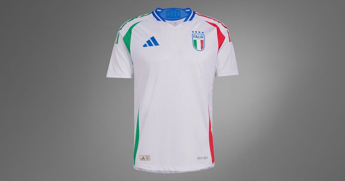 a white soccer jersey with red , green and blue stripes on a gray background .