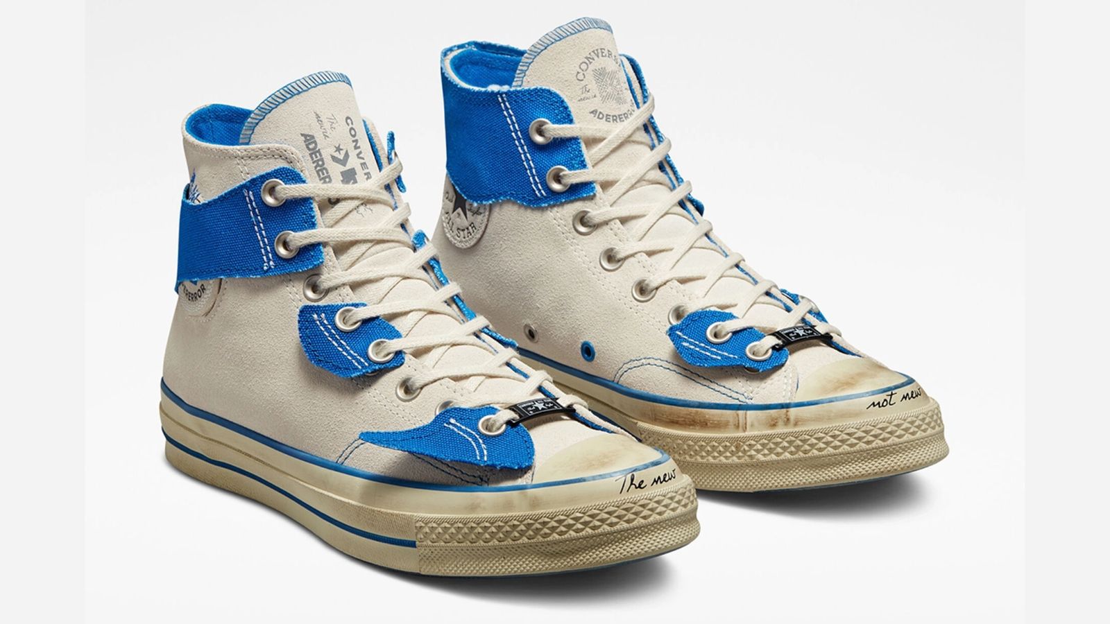 ADER ERROR x Converse Chuck 70 Hi "Create Next" product image of a white pair of sneakers with ripped blue overlays.