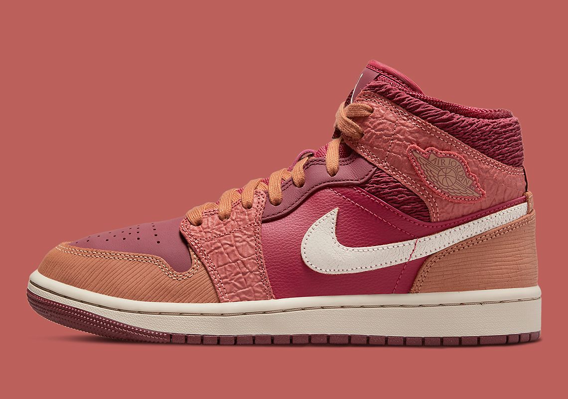 Air Jordan 1 Mid Africa product image of a pink, red, and beige sneaker.