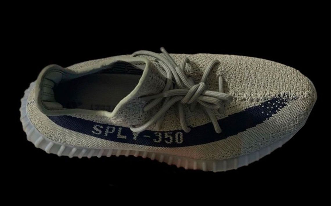 adidas Yeezy Boost 350 v2 "Granite" product image of a greyish Primeknit sneaker with a black stripe down the side.