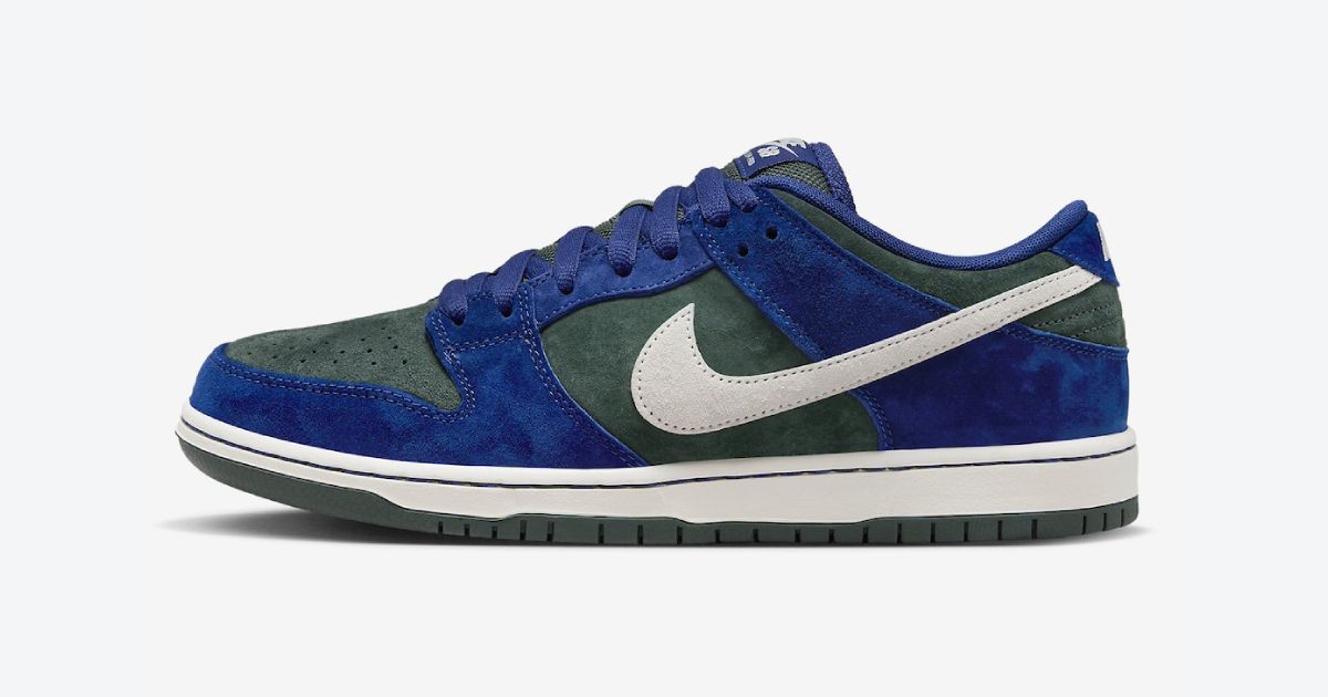 Nike SB Dunk Low "Deep Royal Blue" product image of a dark green and blue suede low-top with an off-white midsole and Swoosh down the side.