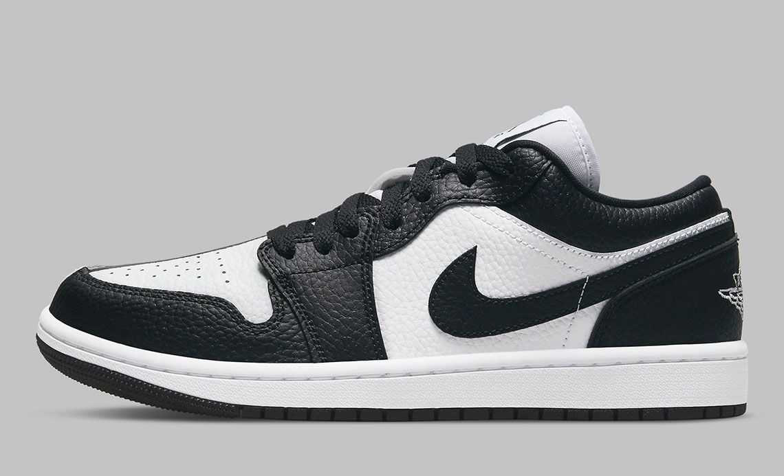 Air Jordan 1 Low "Homage" product image of a black and white sneaker split and inverted down the middle.