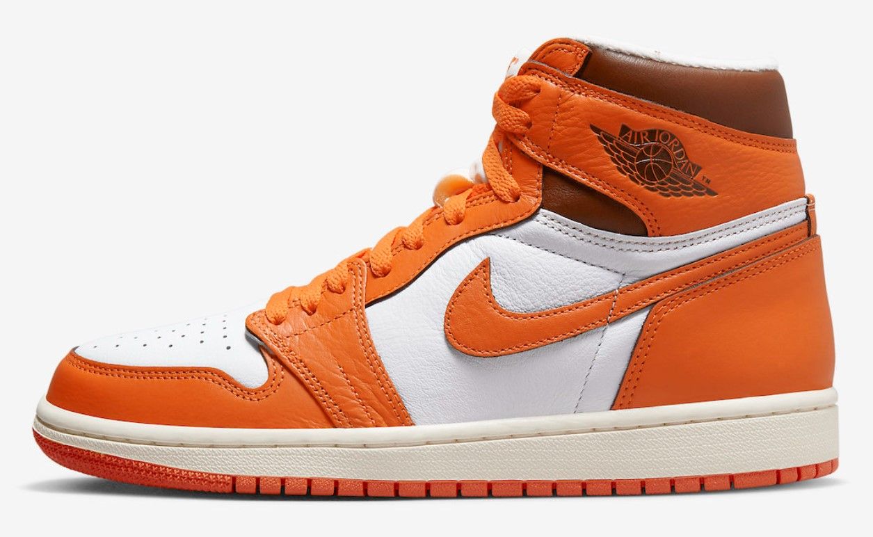 Air Jordan 1 High OG "Starfish" product image of a white leather sneaker with orange overlays and black details.