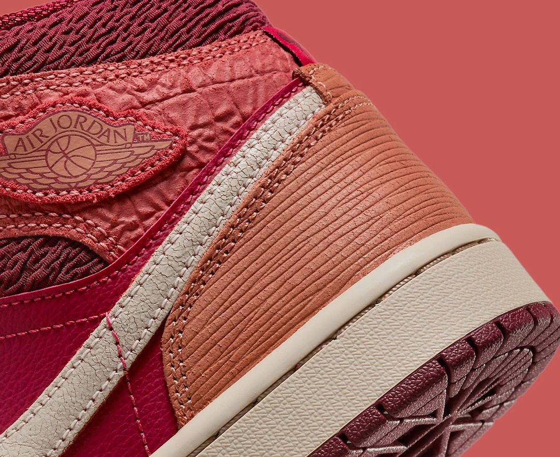 Air Jordan 1 Mid Africa product image of a pink, red, and beige sneaker.