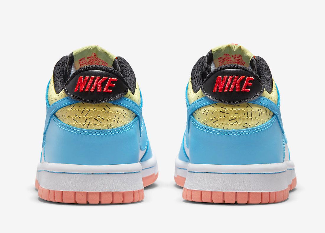 Kyrie Irving Nike Dunk Low product image of a white and light blue sneaker with hints of yellow, red, as well as a pink rubber outsole.