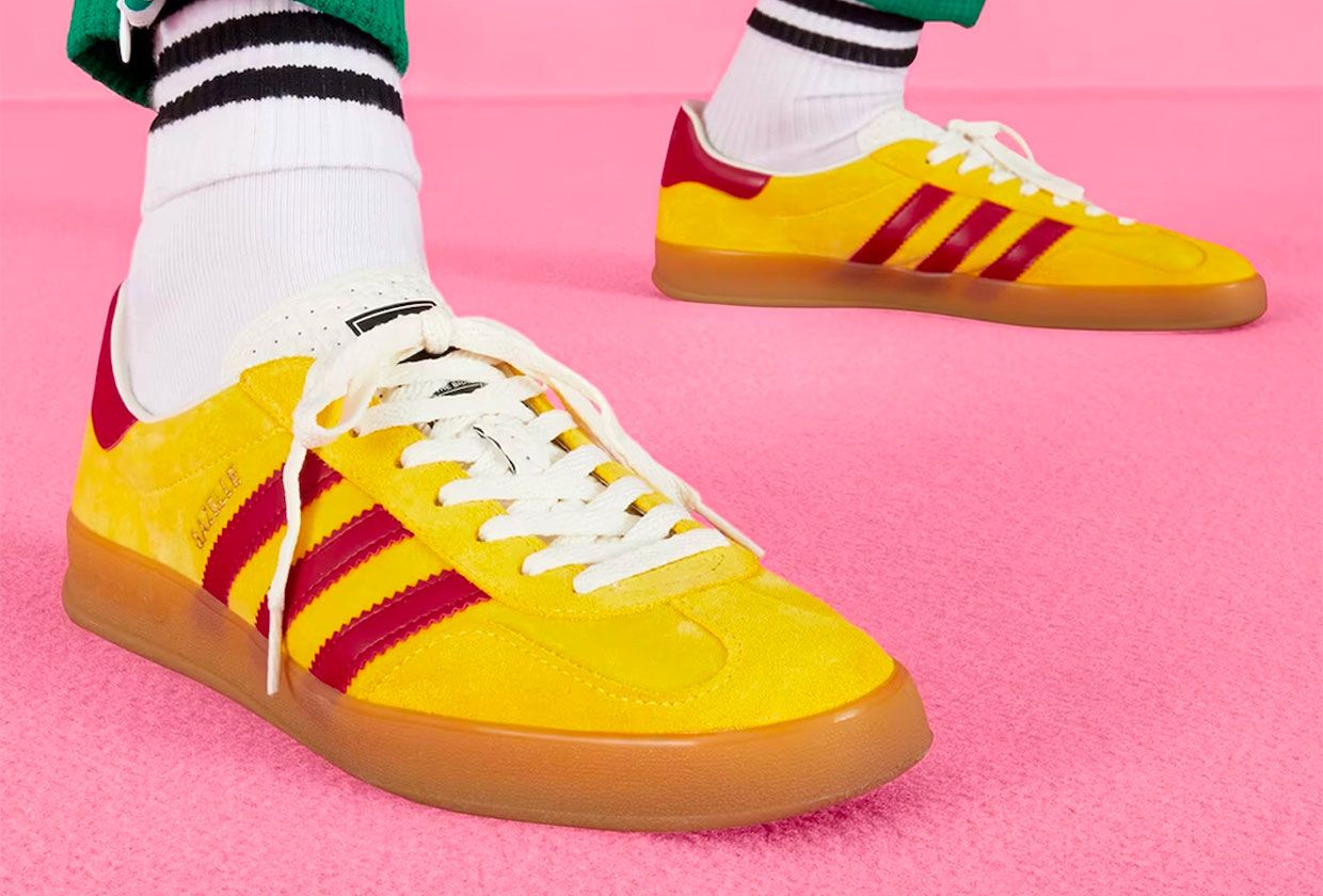 Gucci x adidas Gazelle product image of a pair of yellow sneakers with red details and white laces.