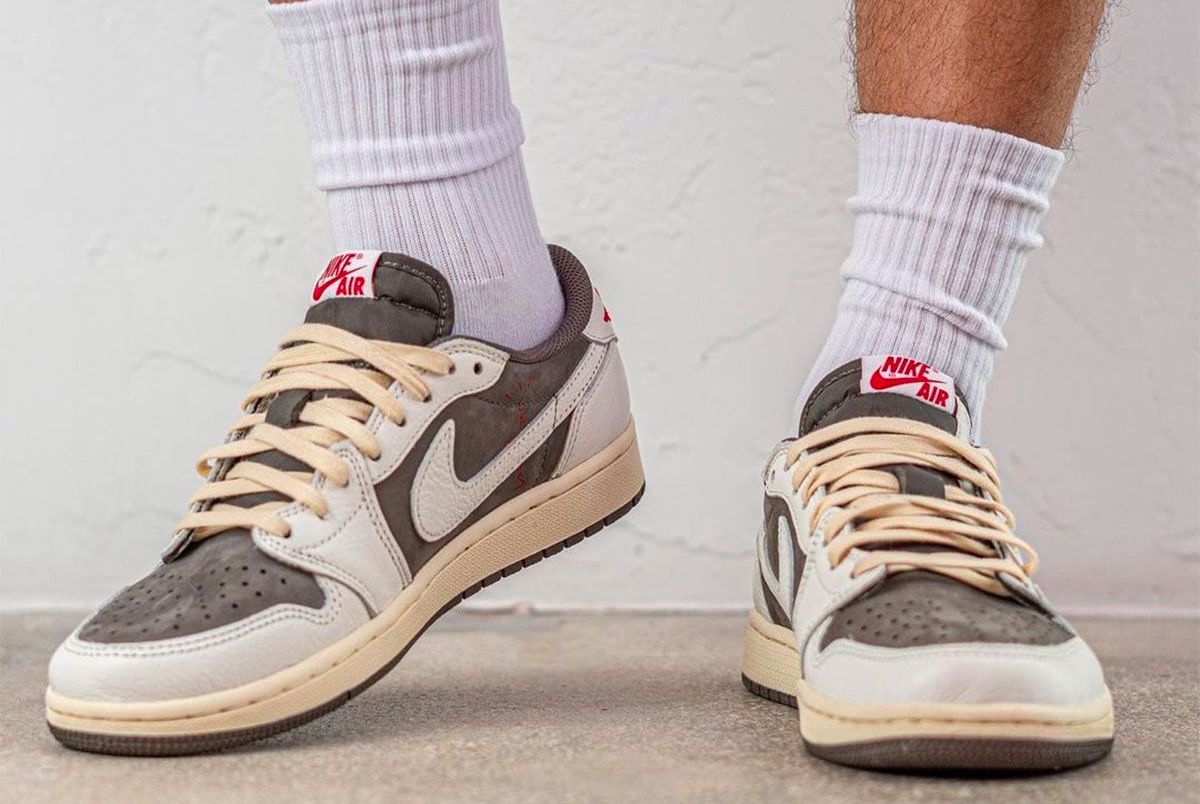 Travis Scott x Air Jordan 1 Low "Reverse Mocha" product image of a sail and brown suede pair of sneakers with reverse Swooshes.