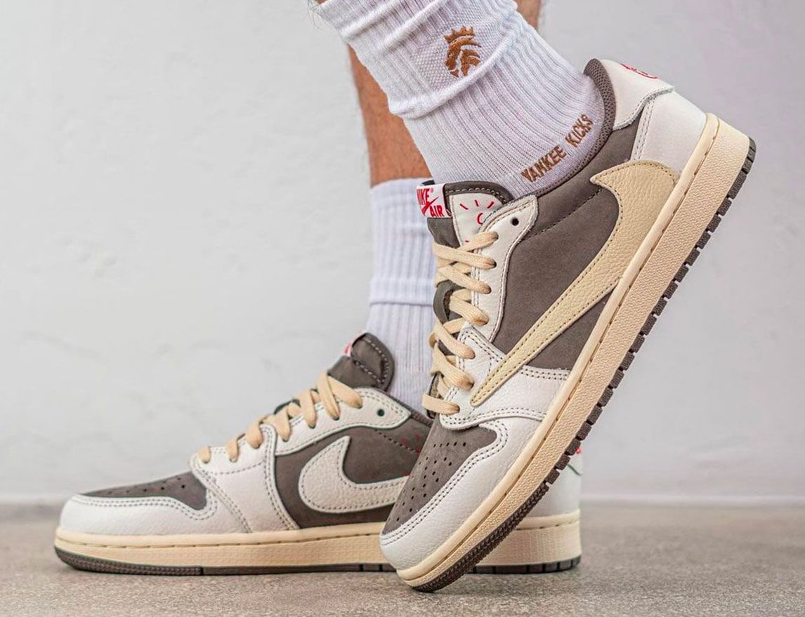 Travis Scott x Air Jordan 1 Low "Reverse Mocha" product image of a sail and brown suede pair of sneakers with reverse Swooshes.