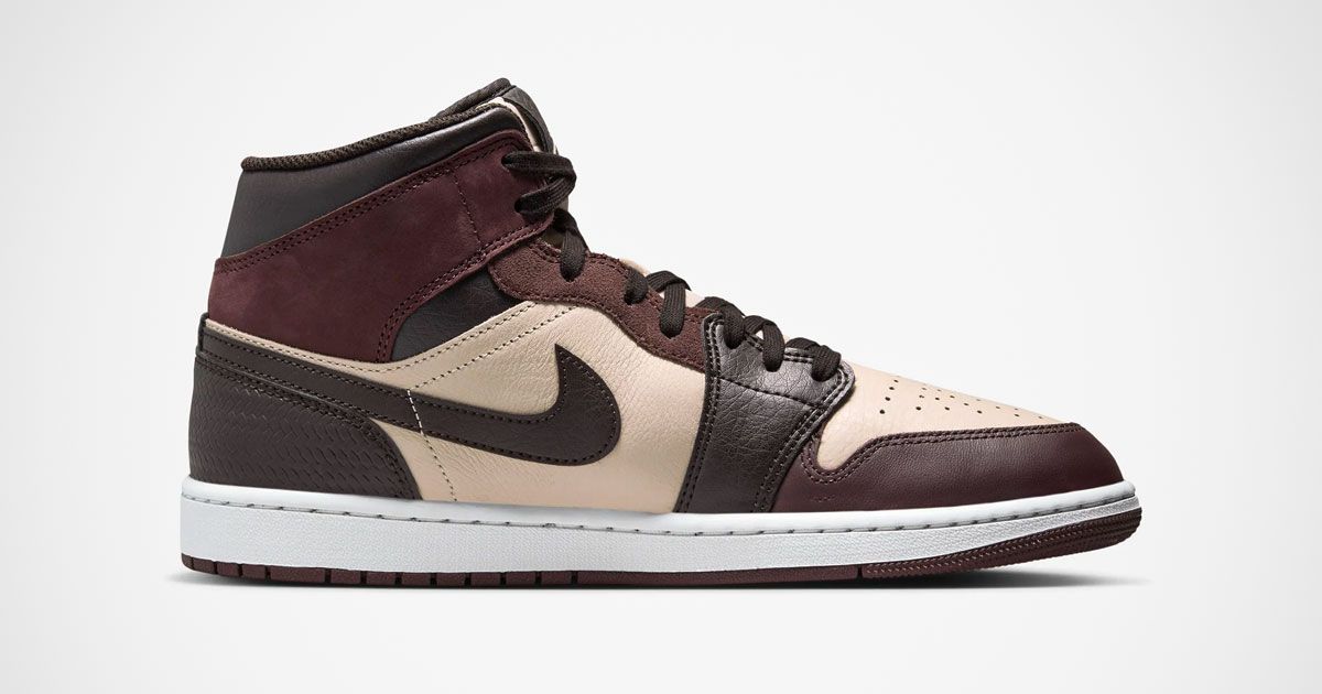 A mid-top Jordan 1 sneaker in two brown shades and cream.