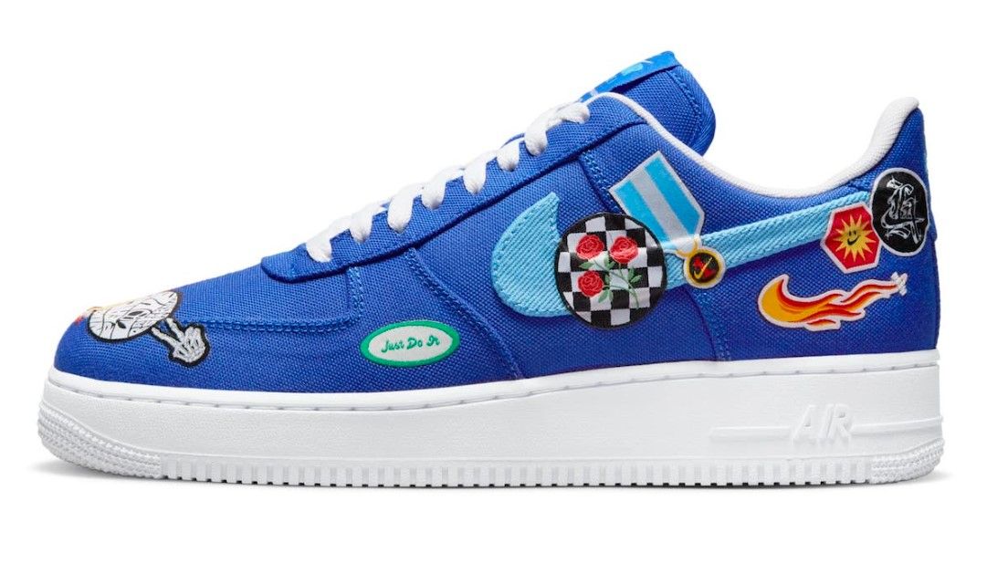 Nike Air Force 1 "Los Angeles" product image of dark blue canvas sneakers featuring several LA-themed patches. 