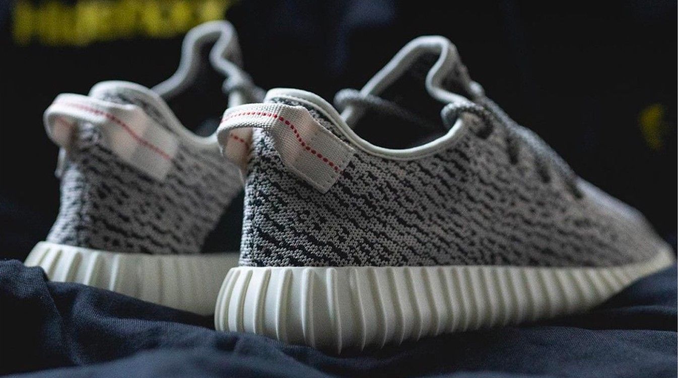 adidas Yeezy Boost 350 "Turtle Dove" product image of grey and black fabric sneakers with white Boost midsoles.