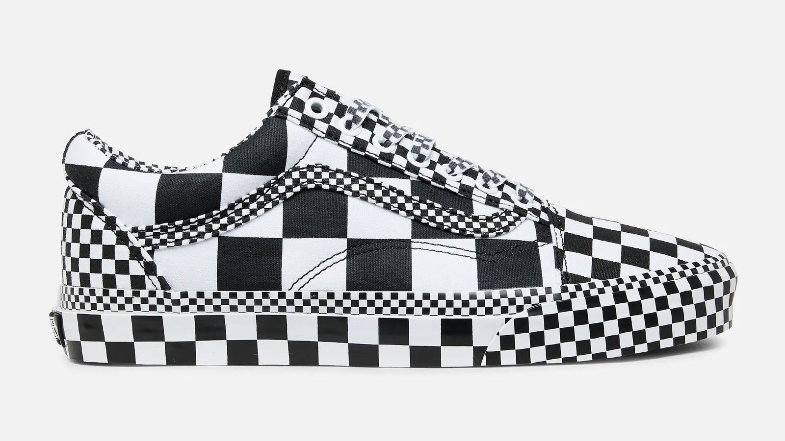 Vans Old Skool All-Over Checkerboard product image of a white and black sneaker with a checkerboard pattern all over.