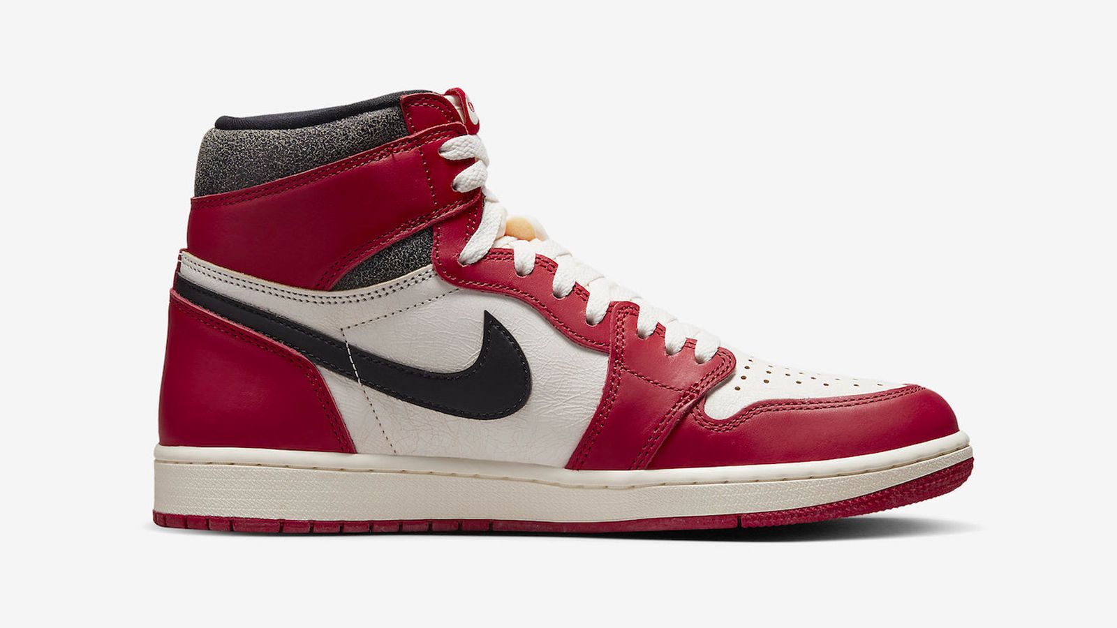 Air Jordan 1 "Chicago" product image of a white, red, and black leather sneaker.