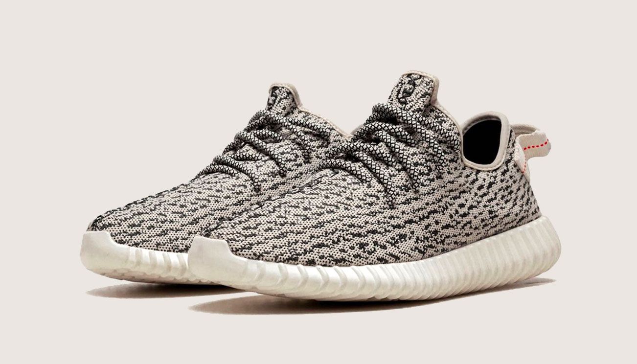 adidas Yeezy Boost 350 "Turtle Dove" product image of grey and black fabric sneakers with white Boost midsoles.