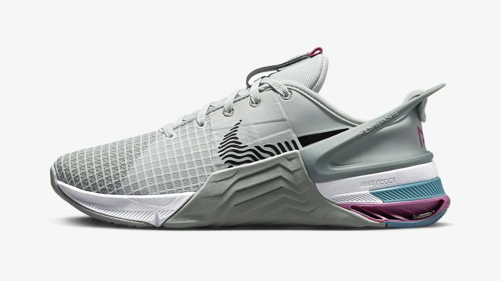 Nike Metcon 8 product image of a light grey trainer with purple and blue details around the heel.