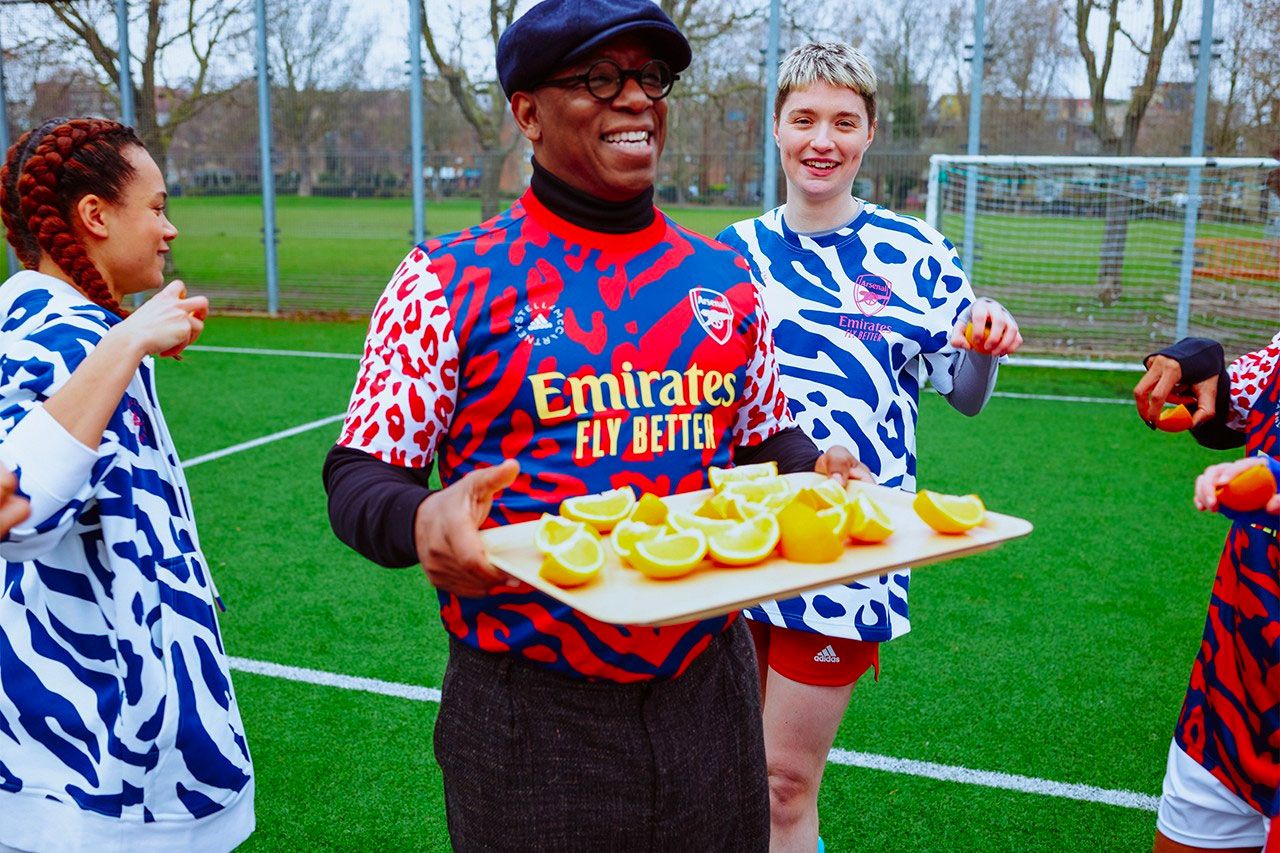 Arsenal x adidas by Stella McCartney collection of red, white, and blue tracksuits and kit.