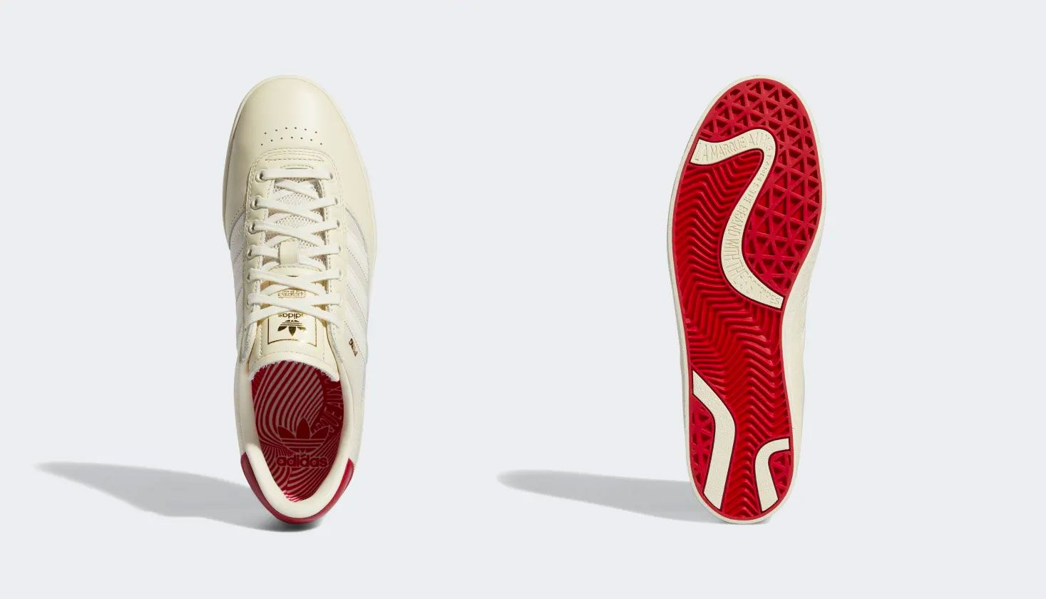 adidas Puig Indoor Shoes product image of a cream white and scarlet sneaker.