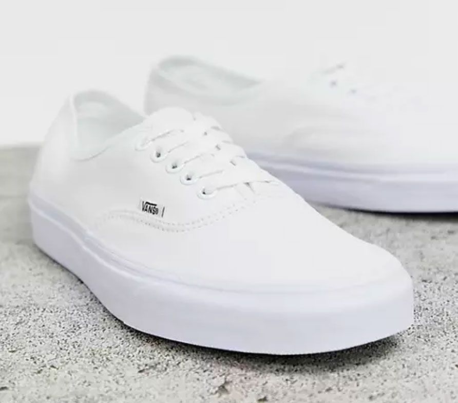 Vans product image of a pair of all-white canvas sneakers.