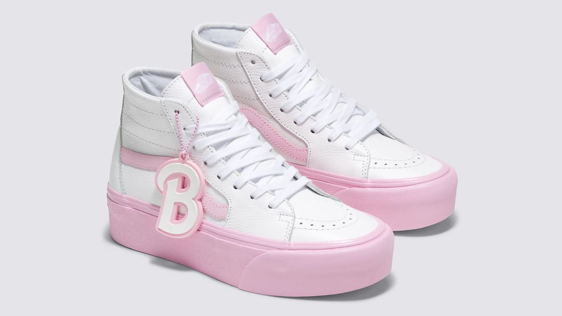 Barbie x Vans Sk8-Hi Tapered Stackform product image of a pair of white leather high-tops featuring a 34mm pink midsole and a hanging white and pink "B" logo.