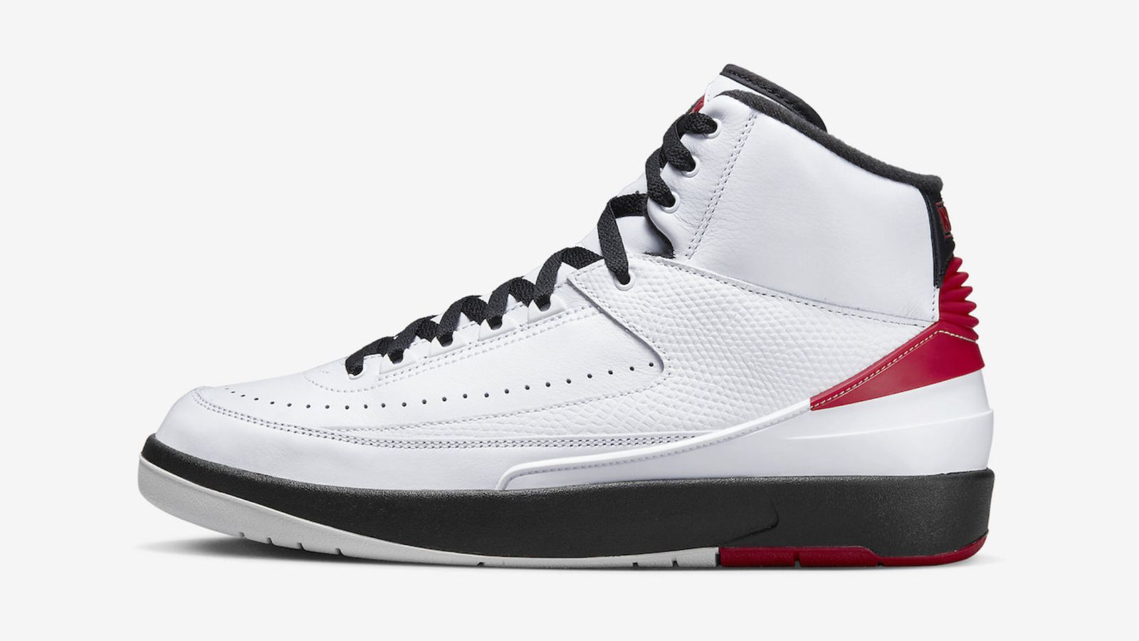 Air Jordan 2 "Chicago" product image of a pair of white, red, and black leather sneakers. 